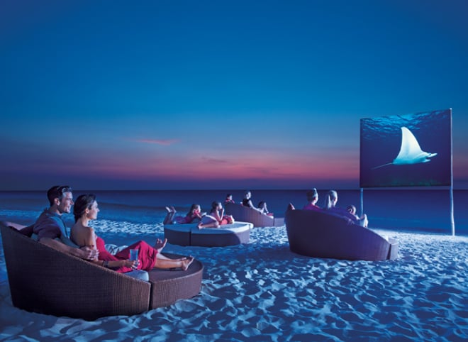 Guests can enjoy a movie under the stars at a Dreams Resort & Spa.