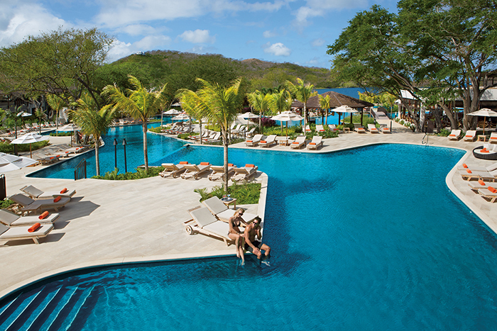 Enjoy some time by the pool at Dreams Las Mareas Costa Rica.